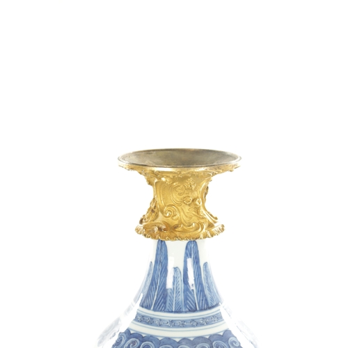 125 - AN 18TH CENTURY CHINESE BLUE AND WHITE BULBOUS VASE WITH CAST ORMOLU NECK MOUNT decorated with circu... 