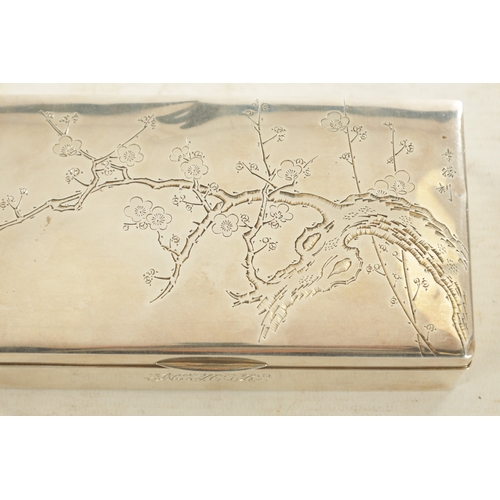 134 - A JAPANESE MEIJI PERIOD SILVER AND HARDWOOD CIGARETTE BOX engraved to the top with blossoming branch... 