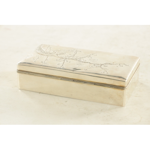 134 - A JAPANESE MEIJI PERIOD SILVER AND HARDWOOD CIGARETTE BOX engraved to the top with blossoming branch... 