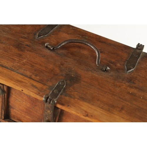 151 - AN 18TH CENTURY FRUITWOOD IRON MOUNTED INDIAN CASKET with strap hinges and panelled front; raised on... 