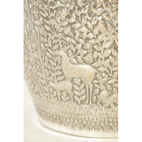 153 - A LARGE LATE 19TH CENTURY INDIAN SILVER METAL JARDINIERE with elephants and animals amongst palm tre... 