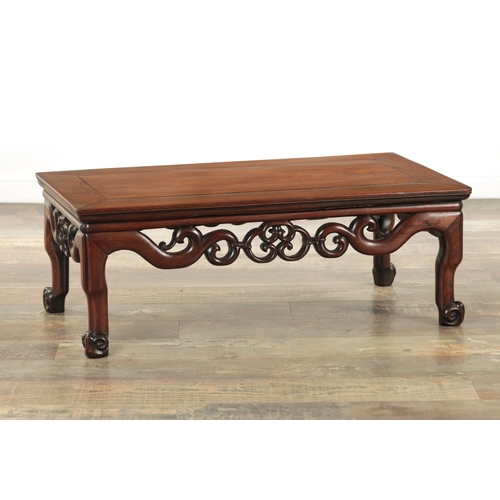 155 - A 19TH CENTURY CHINESE HARDWOOD ALTAR TABLE with panelled top above a openwork carved base and short... 