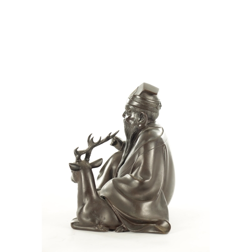 158 - A JAPANESE MEIJI PERIOD BRONZE AND INLAID METAL OKIMONO of Jurojin seated with a deer - signed with ... 