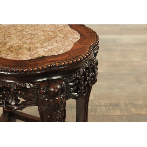 159 - A 19TH CENTURY HARDWOOD CHINESE JARDINIERE STAND with shaped inset marble top above a pierced leaf c... 