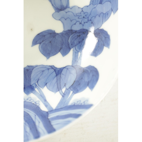 172 - A JAPANESE ARITA NABESHIMA BLUE AND WHITE DISH FROM THE HENRY SANDON COLLECTION with traditional flo... 