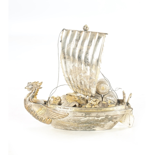 175 - A JAPANESE MEIJI PERIOD SILVER AND SILVER GILT TAKARABUNE modelled as a sailing treasure ship with a... 