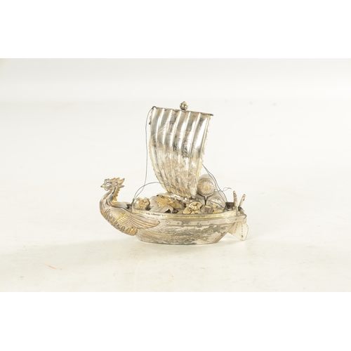 175 - A JAPANESE MEIJI PERIOD SILVER AND SILVER GILT TAKARABUNE modelled as a sailing treasure ship with a... 