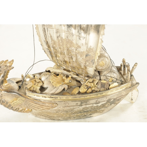 175 - A JAPANESE MEIJI PERIOD SILVER AND SILVER GILT TAKARABUNE modelled as a sailing treasure ship with a... 