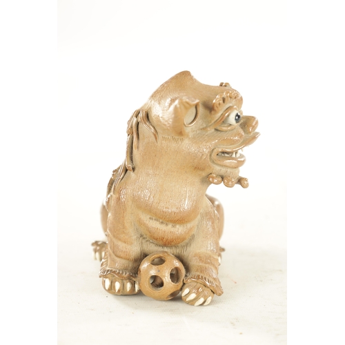 177 - A 19TH CENTURY CHINESE SALT GLAZE TERRACOTTA SEATED FOO DOG - impressed seal mark beneath (14cm high... 