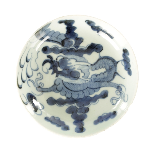 178 - AN 18TH CENTURY JAPANESE BLUE AND WHITE PORCELAIN DISH painted with a dragon amongst clouds - signed... 