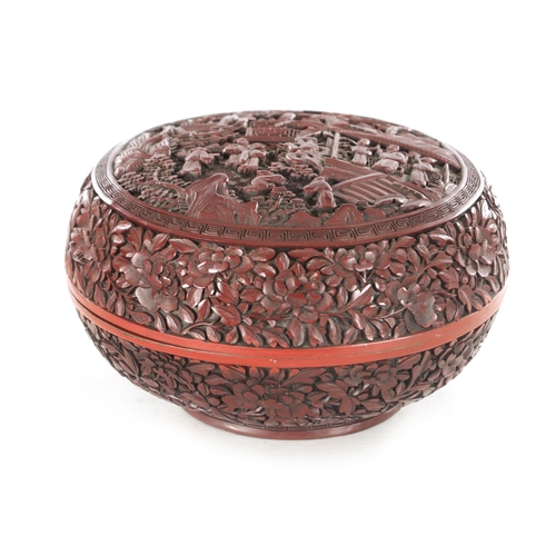 181 - A 19TH CENTURY CHINESE CINNABAR LACQUER BOWL AND COVER OF LARGE SIZE with overall carved foliated de... 