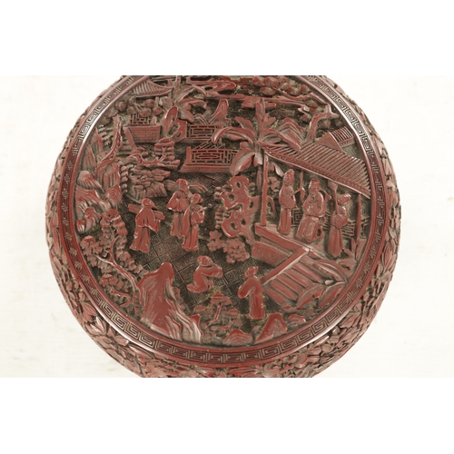 181 - A 19TH CENTURY CHINESE CINNABAR LACQUER BOWL AND COVER OF LARGE SIZE with overall carved foliated de... 