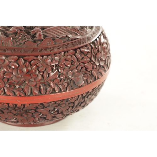 181 - A 19TH CENTURY CHINESE CINNABAR LACQUER BOWL AND COVER OF LARGE SIZE with overall carved foliated de... 