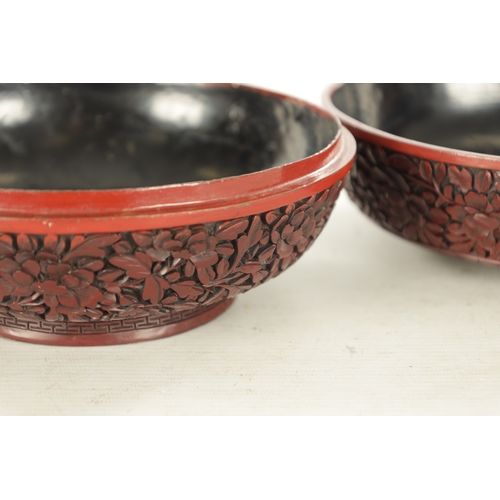 181 - A 19TH CENTURY CHINESE CINNABAR LACQUER BOWL AND COVER OF LARGE SIZE with overall carved foliated de... 