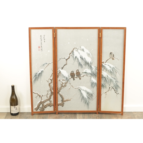 188 - A JAPANESE MEIJI PERIOD THREE-FOLD WATERCOLOUR FRAMED SCREEN depicting birds perched in winter pine ... 