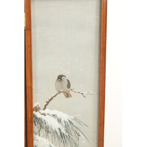 188 - A JAPANESE MEIJI PERIOD THREE-FOLD WATERCOLOUR FRAMED SCREEN depicting birds perched in winter pine ... 