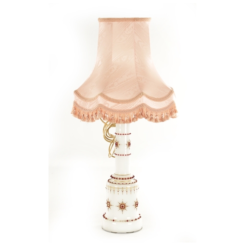 29 - A 19TH CENTURY OPAQUE GLASS TABLE LAMP with ruby glass jewels and gilt decoration. (lamp base 57cm h... 