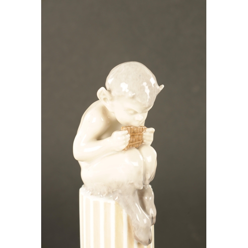 36 - AN EARLY 20TH CENTURY ROYAL COPENHAGEN FIGURE MODELLED AS FAUN ON COLUMNS WITH LIZARD. (21.5cm high)