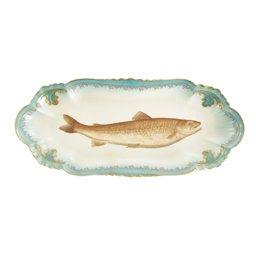 46 - A LATE 19TH CENTURY FRENCH GLAZED POTTERY SALMON DISH the central fish design within a shaped and le... 