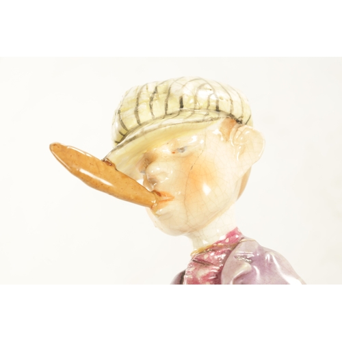 50 - AN EARLY 20TH CENTURY AUSTRIAN PORCELAIN POLYCHROME FIGURE modelled as a jockey smoking a large ciga... 