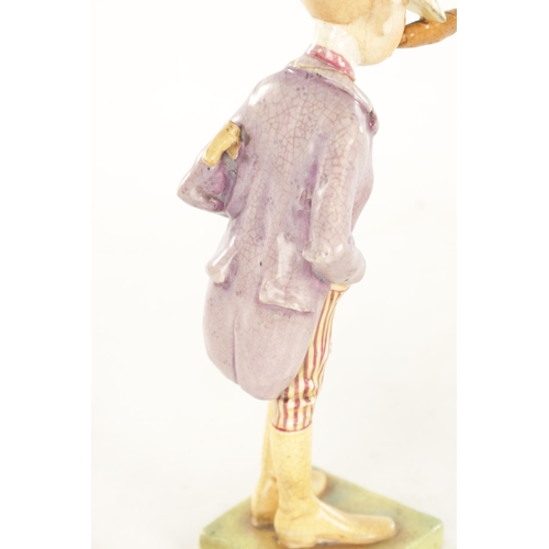 50 - AN EARLY 20TH CENTURY AUSTRIAN PORCELAIN POLYCHROME FIGURE modelled as a jockey smoking a large ciga... 