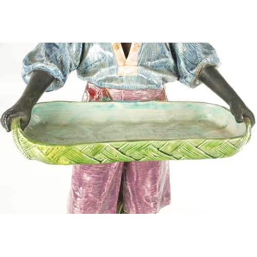 58 - A LARGE EARLY 20TH CENTURY MAJOLICA FIGURAL SCULPTOR modelled as a young lady holding a tray. (76cm ... 