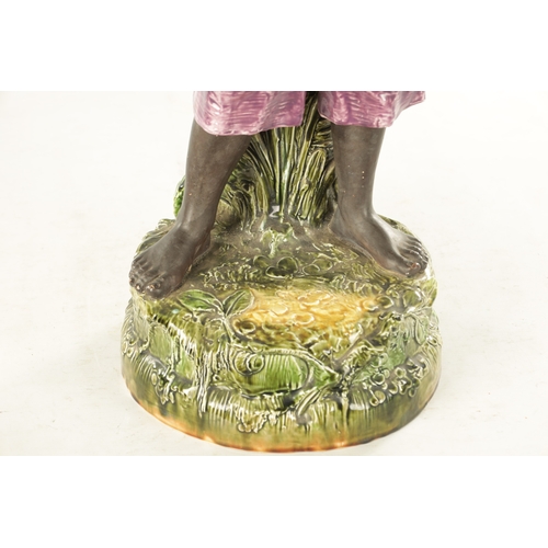 58 - A LARGE EARLY 20TH CENTURY MAJOLICA FIGURAL SCULPTOR modelled as a young lady holding a tray. (76cm ... 