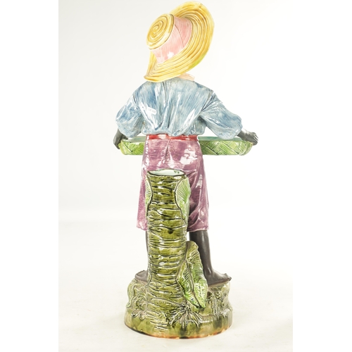 58 - A LARGE EARLY 20TH CENTURY MAJOLICA FIGURAL SCULPTOR modelled as a young lady holding a tray. (76cm ... 