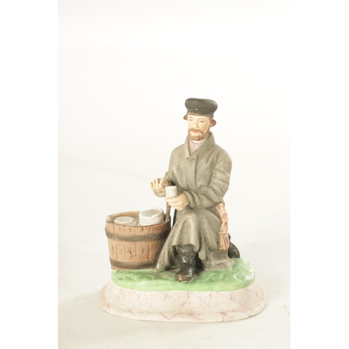 89 - AN IMPERIAL RUSSIAN SEATED JEWISH FIGURE decorated in pastel shades on a rounded plinth base. (11.5c... 