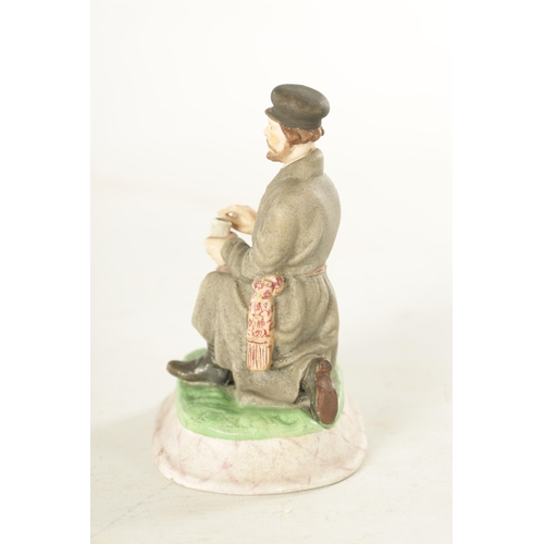 89 - AN IMPERIAL RUSSIAN SEATED JEWISH FIGURE decorated in pastel shades on a rounded plinth base. (11.5c... 