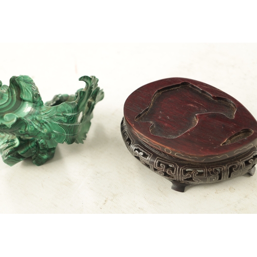 91 - A LATE 19TH CENTURY CHINESE CARVED MALACHITE SCULPTURE of a bird in foliate setting; raised on a wir... 