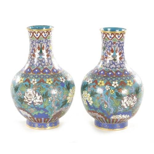 202 - A PAIR OF 19TH CENTURY CHINESE CLOISONNE VASES the bulbous bodies decorated continuous bands of bloo... 