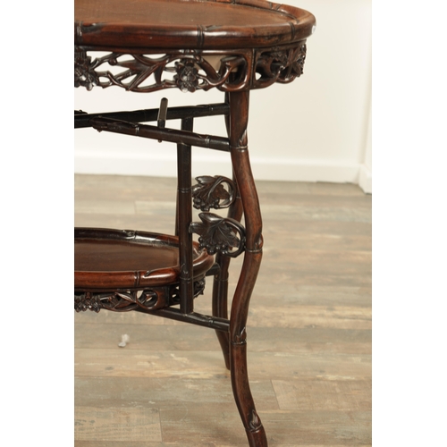 205 - A 19TH CENTURY CHINESE HARDWOOD OVAL SHAPED TWO-TIER TABLE with faux bamboo mouldings and supports d... 