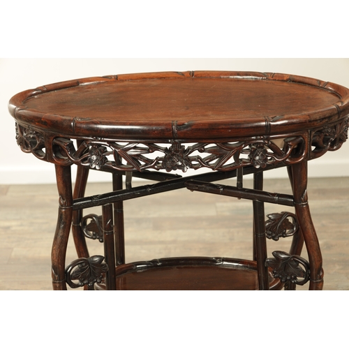 205 - A 19TH CENTURY CHINESE HARDWOOD OVAL SHAPED TWO-TIER TABLE with faux bamboo mouldings and supports d... 