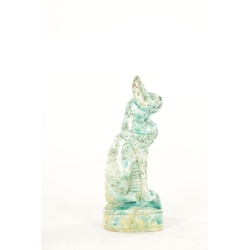 209 - AN EARLY EGYPTIANESQUE STONEWARE SCULPTURE OF A CAT seated in an alert pose on a plinth base glazed ... 