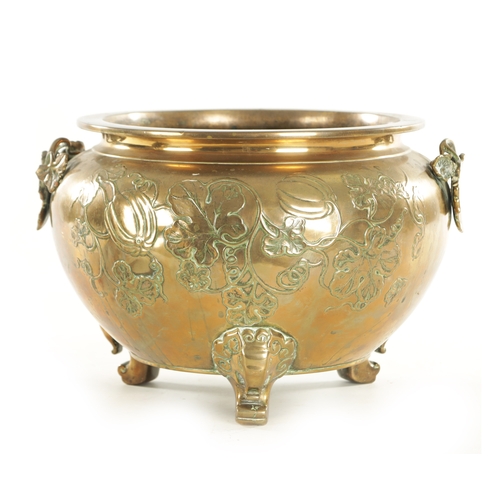 215 - A 19TH CENTURY CHINESE BRONZE JARDINIERE of bulbous squat form decorated with floral work; raised on... 