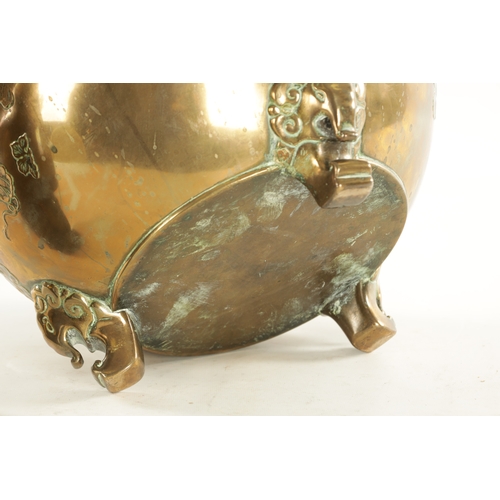 215 - A 19TH CENTURY CHINESE BRONZE JARDINIERE of bulbous squat form decorated with floral work; raised on... 