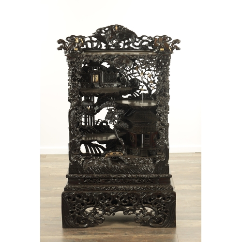 221 - A GOOD 19TH CENTURY CARVED CHINESE HARDWOOD DISPLAY CABINET finely decorated with pierced branchwork... 