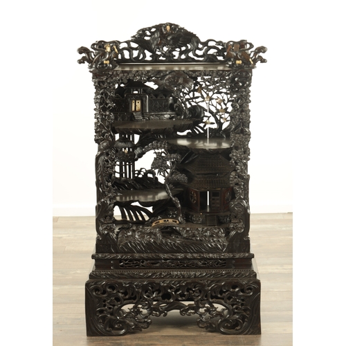 221 - A GOOD 19TH CENTURY CARVED CHINESE HARDWOOD DISPLAY CABINET finely decorated with pierced branchwork... 