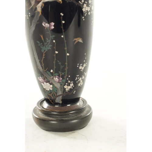 222 - A GOOD JAPANESE MEIJI CLOISONNE CABINET VASE depicting a bird of prey perched on flowering and bloss... 