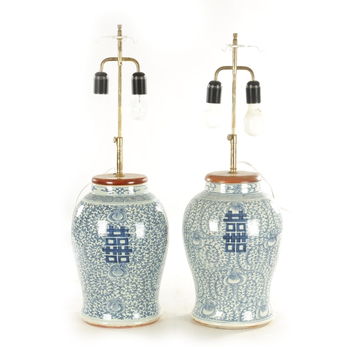 226 - A PAIR OF 18TH CENTURY CHINESE BLUE AND WHITE VASES having table light fittings - signed with four c... 