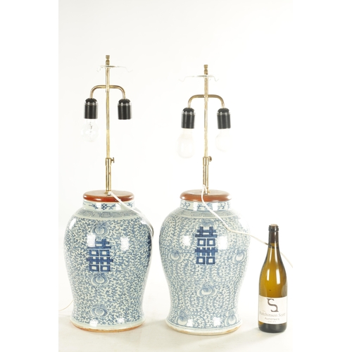 226 - A PAIR OF 18TH CENTURY CHINESE BLUE AND WHITE VASES having table light fittings - signed with four c... 