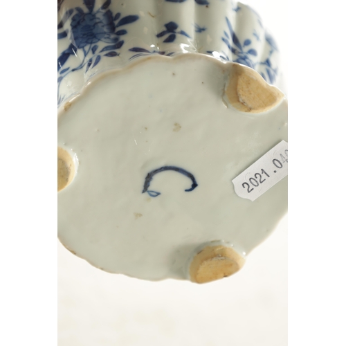 231 - AN EARLY CHINESE BLUE AND WHITE TEAPOT BEARING KANGXI MARK BENEATH the shaped and fluted body with t... 