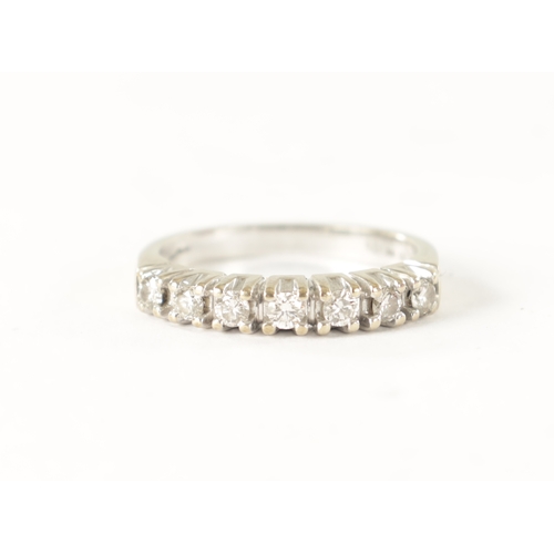 233 - A 9CT GOLD SEVEN STONE DIAMOND ETERNITY RING, each in a four claw setting. Total weight app. 2.6g