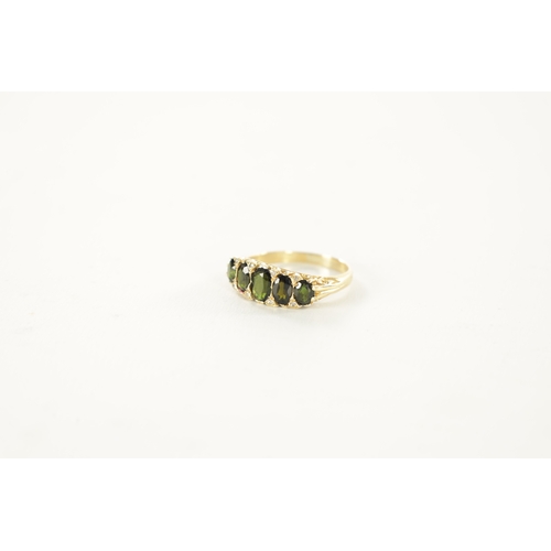 235 - AN 18CT GOLD TOURMALINE AND DIAMOND RING, the five oval cut peridots on a pierced scrollwork mount w... 