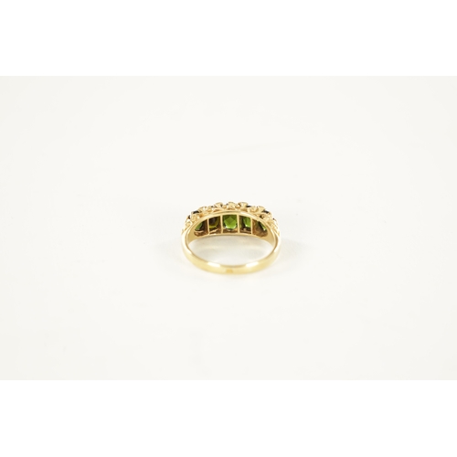 235 - AN 18CT GOLD TOURMALINE AND DIAMOND RING, the five oval cut peridots on a pierced scrollwork mount w... 