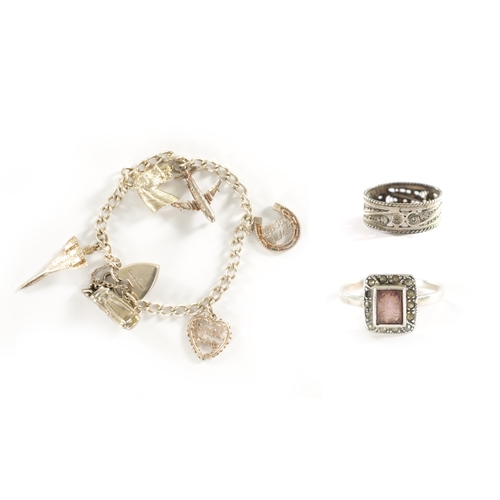 242 - A COLLECTION OF JEWELLERY, comprising of a 14ct white gold and amethyst ring, a charm bracelet and a... 