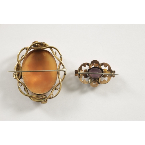 243 - TWO 19TH CENTURY GOLD METAL BROOCHES, a large cameo brooch with three classical maidens and an oval ... 