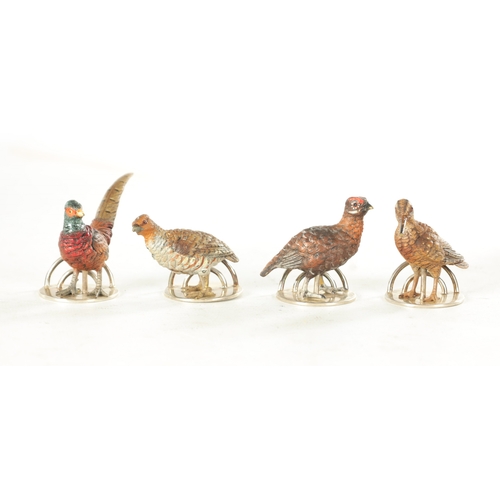 244 - A CASED SET OF FOUR COLD-PAINTED BRONZE AND SILVER METAL GAME BIRD MENU HOLDERS mounted on circular ... 