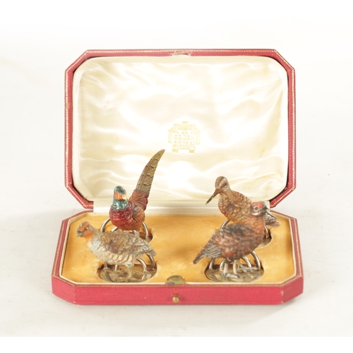 244 - A CASED SET OF FOUR COLD-PAINTED BRONZE AND SILVER METAL GAME BIRD MENU HOLDERS mounted on circular ... 